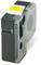 A black printer cartridge with transparent sections and a yellow label on the top surface.