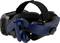 Virtual reality headset with black and blue components, pictured from the side, showing headband and integrated headphones.