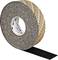 A roll of rough, black adhesive tape with partially detached protective backing.