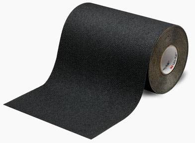 A large roll of black sandpaper, partially unrolled, on a light background.