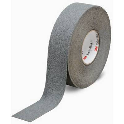 A roll of grey non-slip adhesive tape on a white background, partially unrolled.