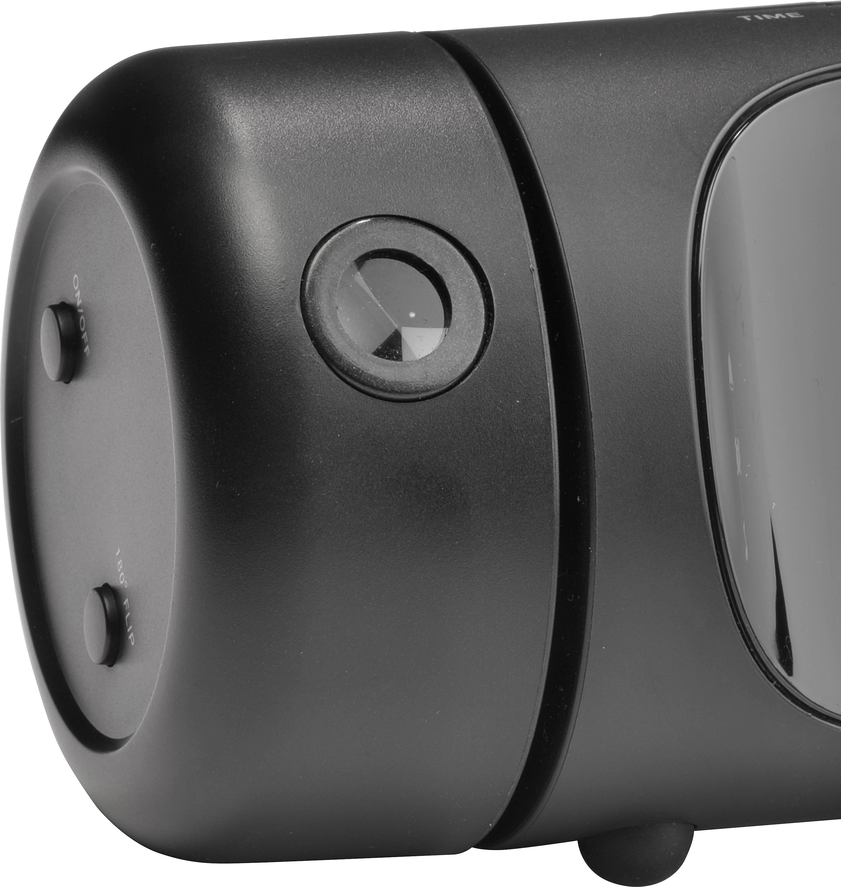 'Close-up of a black device with a round lens at the top and control buttons on the side.'