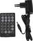 A black remote control with buttons and a matching black power adapter. The remote control has numbered buttons and function keys.