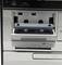 A cassette is inserted into the deck of an audio system. Above are USB and SD/MMC ports.