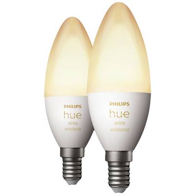 Two Philips Hue White Ambiance LED candle bulbs with E14 bases, illuminated, suitable for customisable ambient lighting.
