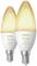 Two Philips Hue White Ambiance LED light bulbs with E14 bayonet cap; they emit a warm white light.