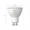 A white Philips Hue light bulb, model 'white and colour', GU10 fitting, 50 mm diameter and 58 mm height.