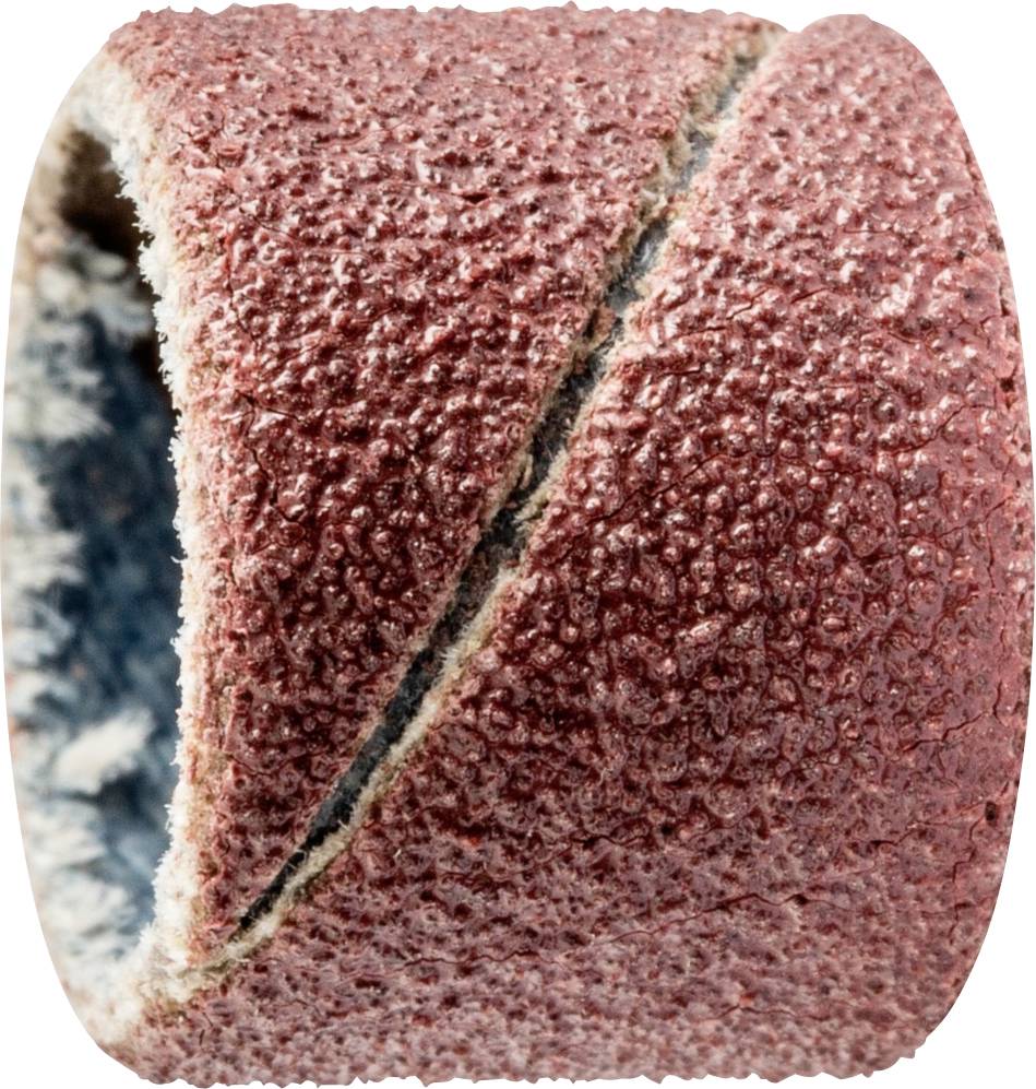 A coarse-grained sanding belt ring in close-up, its rough, sand-coloured texture clearly showing the abrasive grains, intersected by a diagonal line.
