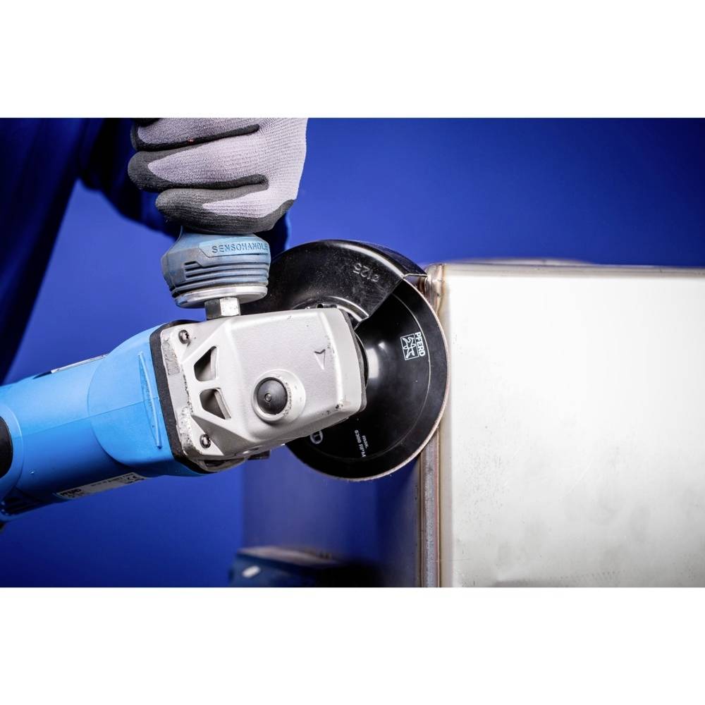 A person is using an angle grinder to work on a metal edge. The blue background highlights the tool.