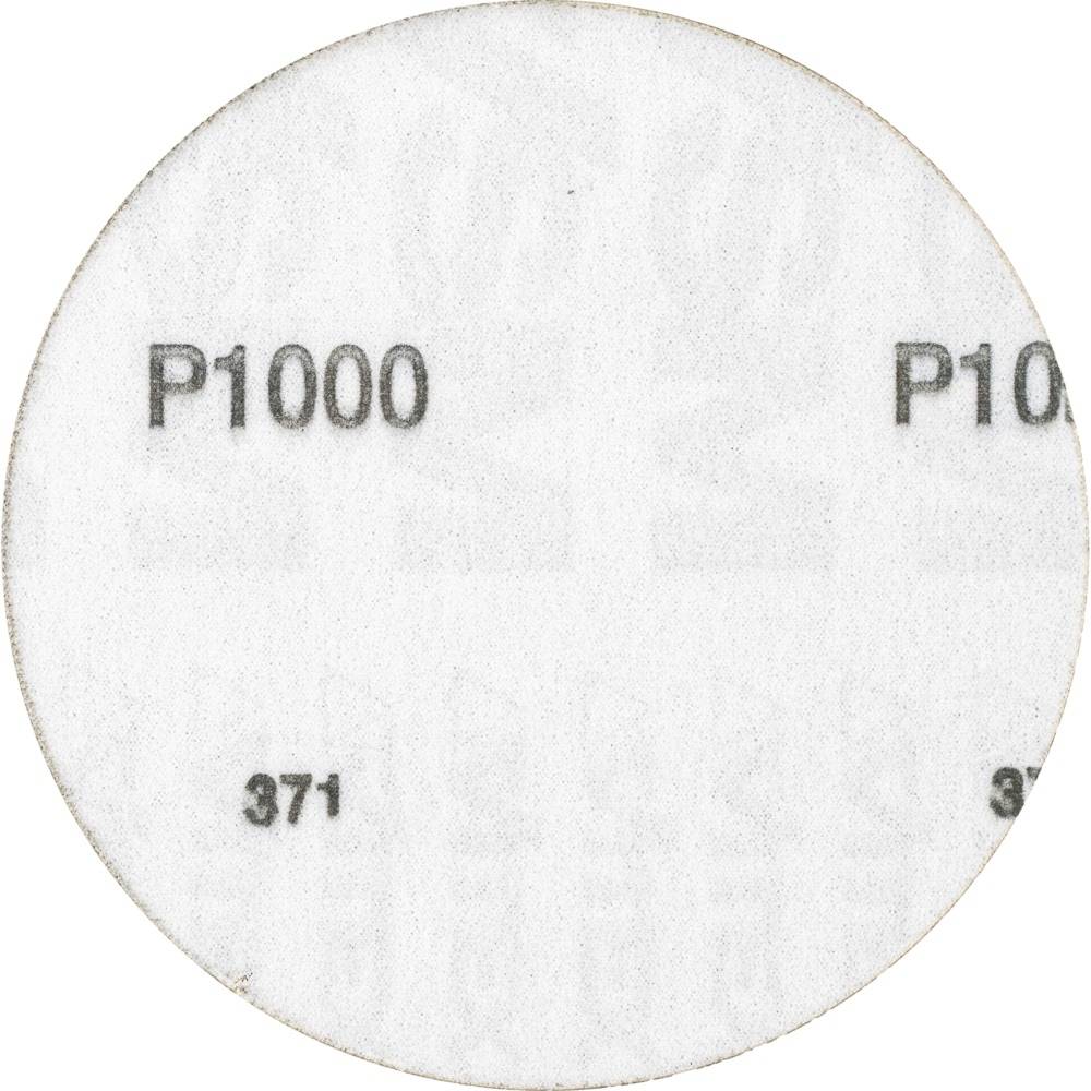 Round grinding disc with the inscription 'P1000' and '371', indicating the grain size for fine grinding.