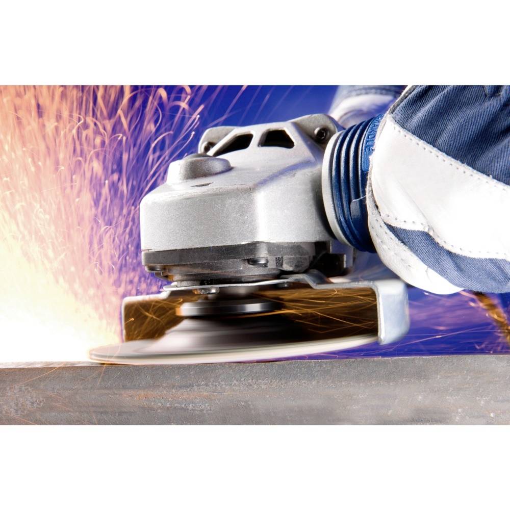 A hand wearing a protective glove holds an angle grinder, which is spraying sparks as it glides over a metal surface.