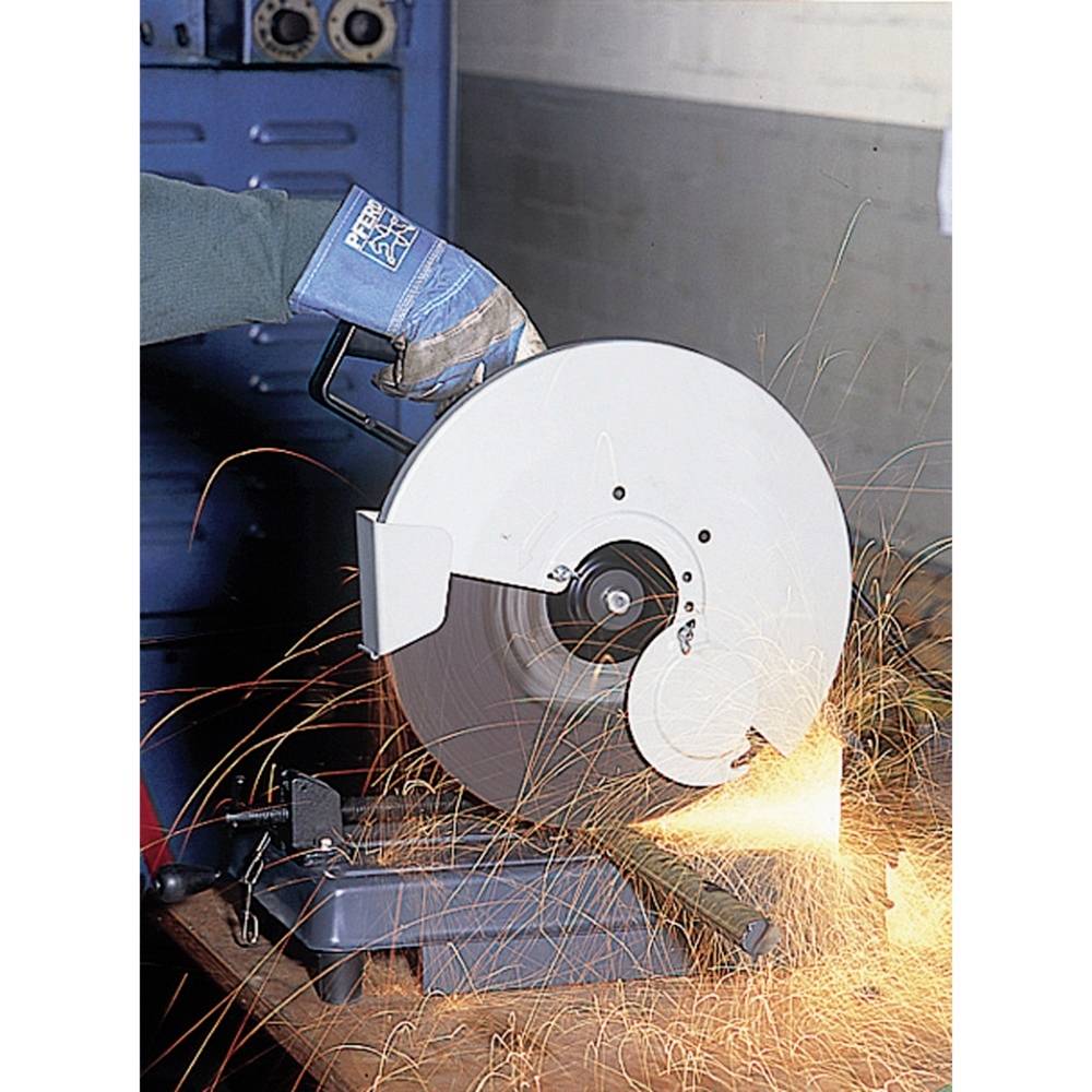 A person is using an angle grinder, with sparks flying from it. The person is wearing a protective glove.