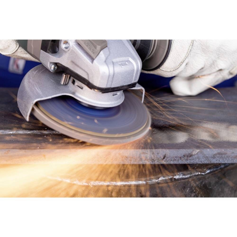 A close-up of an angle grinder gliding over a metal surface, with sparks flying.