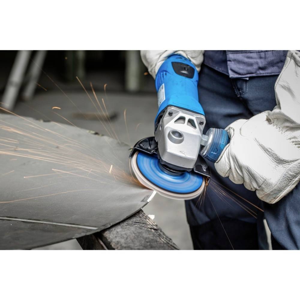 'Close-up of a person working with a blue electric grinding machine, grinding metal. Sparks are flying during the grinding process.'