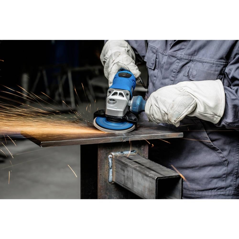 A person is grinding metal with an angle grinder, sparks flying. Protective clothing worn.