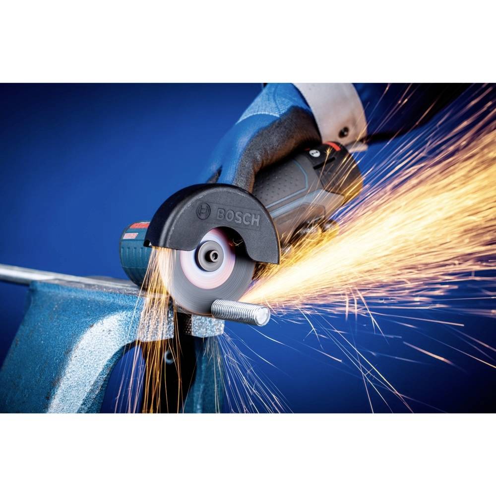 Electric power tool cutting a metal rod, sparks flying. The contrast between the blue background and orange sparks is visible.