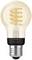 Lightbulb with visible spiral filament, warm white light colour, Philips Hue brand, decorative retro design, E27 fitting.