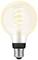 Light bulb with spiral filament and E27 bayonet cap, emitting warm white light. Brand name and model not identifiable.