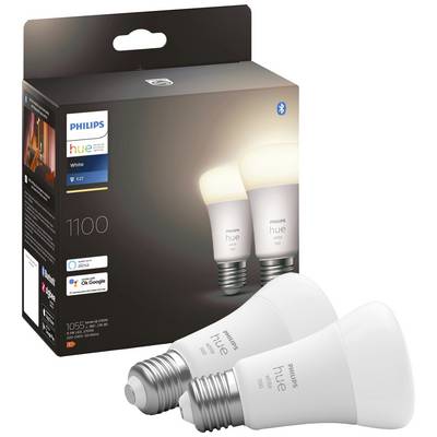 Two Philips Hue LED light bulbs in front of their product packaging. Packaging displays brand logo and compatibility with voice assistants.