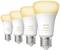 Four Philips Hue 'white ambiance' LED light bulbs lined up with warm white light. Energy-efficient lighting solution.
