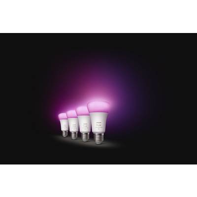 A row of four intelligent light bulbs illuminates in vibrant pink against a dark background.