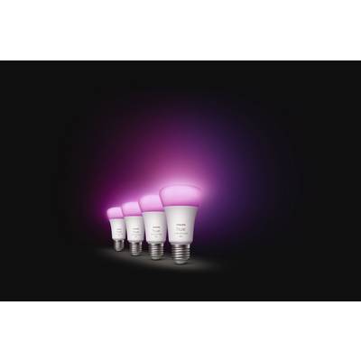 Four smart LED light bulbs with pink illumination on a dark background, arranged in a row, create a mood-enhancing atmosphere.