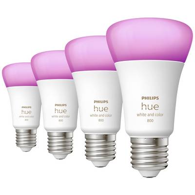Four Philips Hue light bulbs with white and coloured light. Light bulbs glowing pink. Ideal for atmospheric lighting.