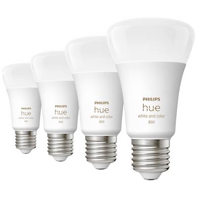 Four smart light bulbs from Philips Hue, model "white and colour", are lined up in a row, each with a silver fitting.