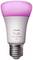 A Philips Hue light bulb, illuminating from the top in pink. Text on the bulb: 'Philips hue white and color 1100'.