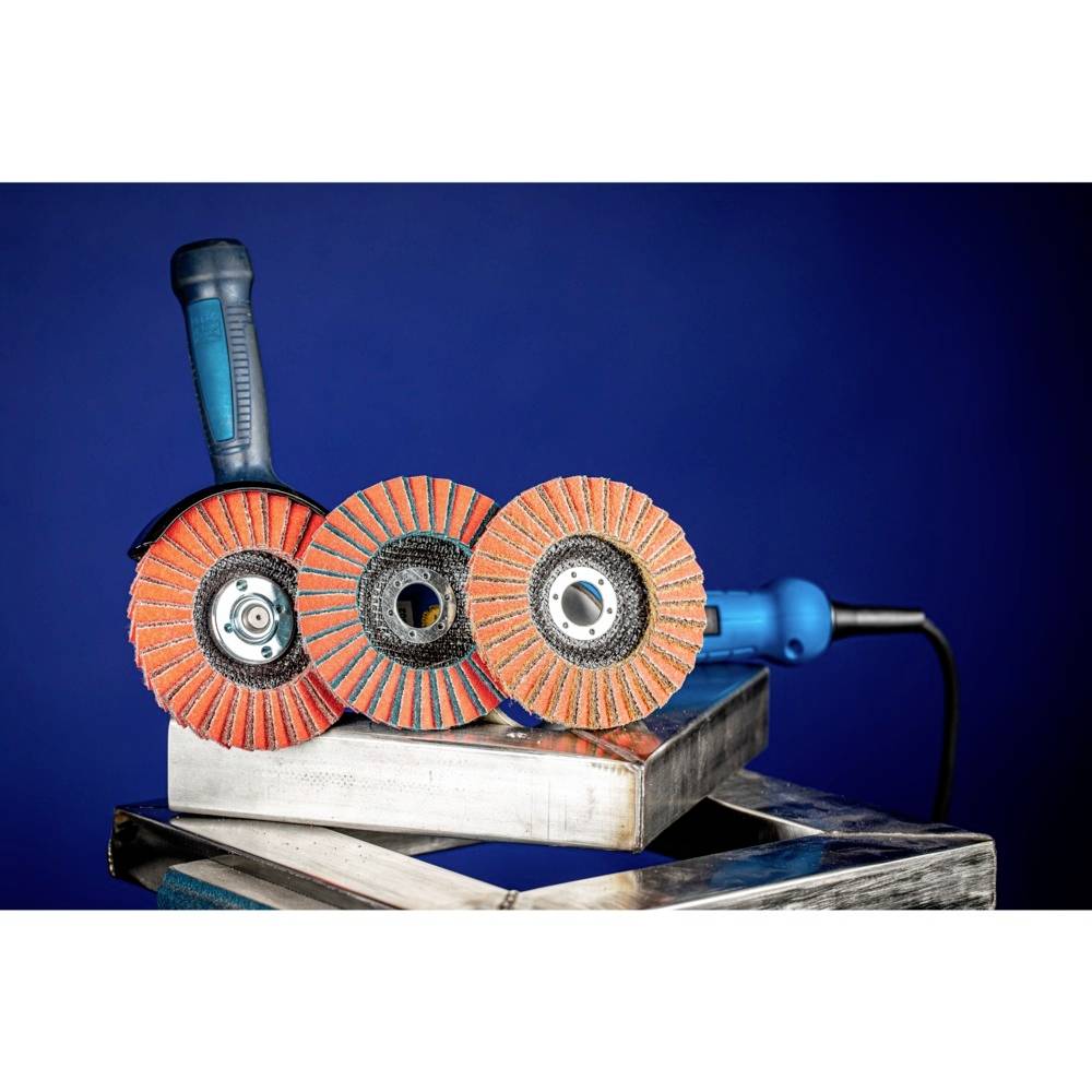 An electric grinding tool with three rotating grinding discs made of red material, mounted on a metal frame against a blue background.