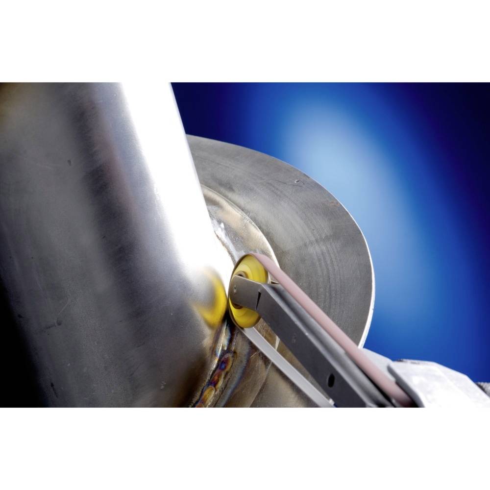 A grinding tool polishes the weld on a large metal pipe. The background is blue-lit.