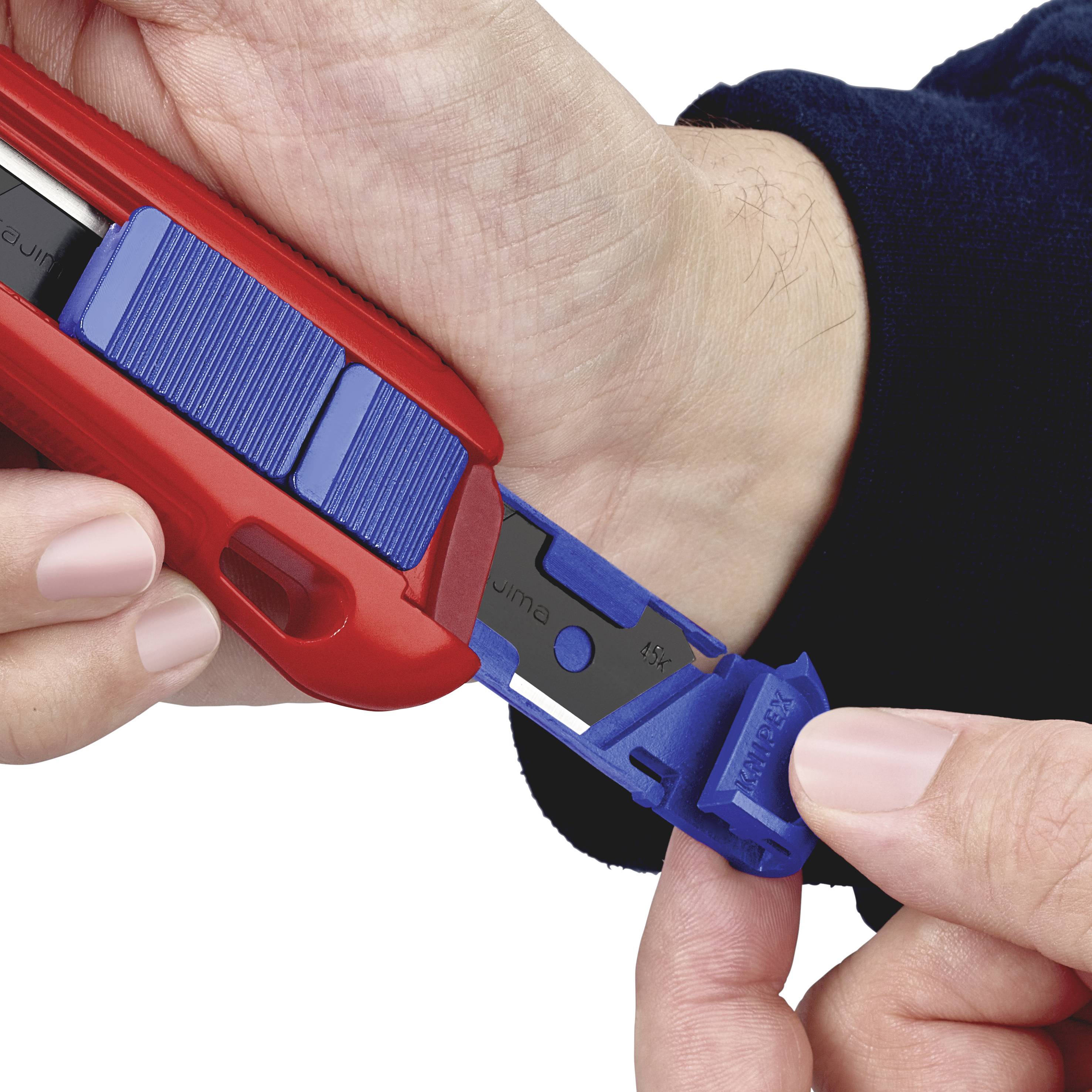 A person is holding a blue single-use safety lancet device in their right hand, while their left hand activates the release mechanism.