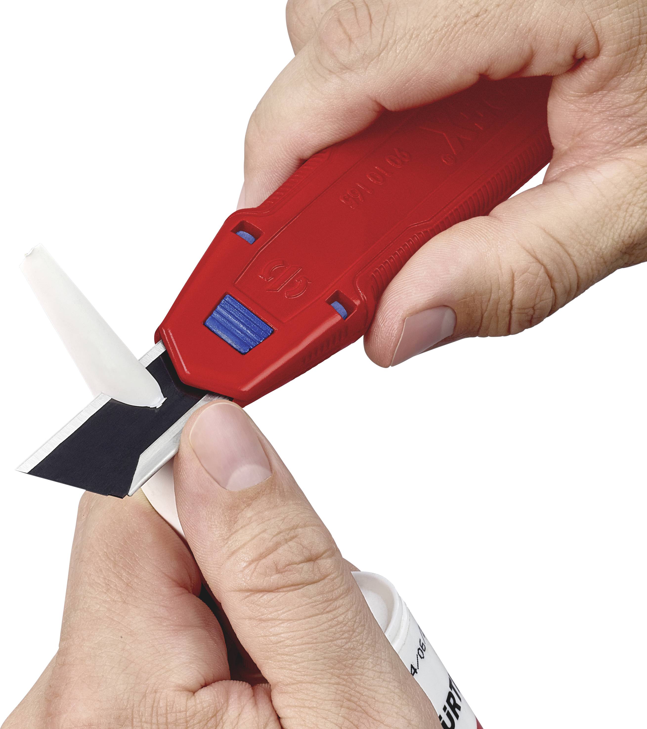 Two hands are using a red cutting tool to trim the tip of a white cartridge nozzle.