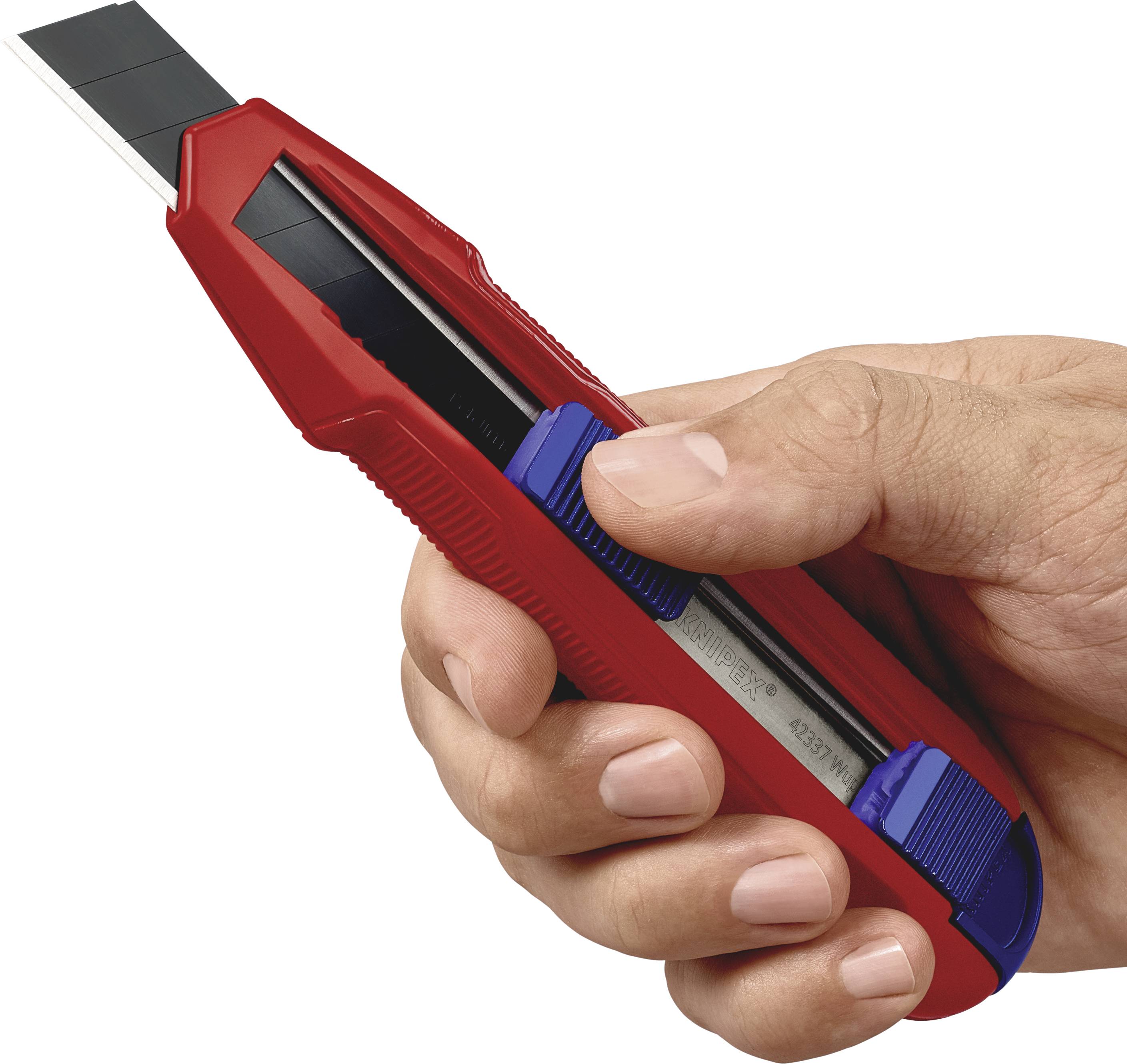 A hand holds a red Stanley knife with the blade extended, ready to cut.