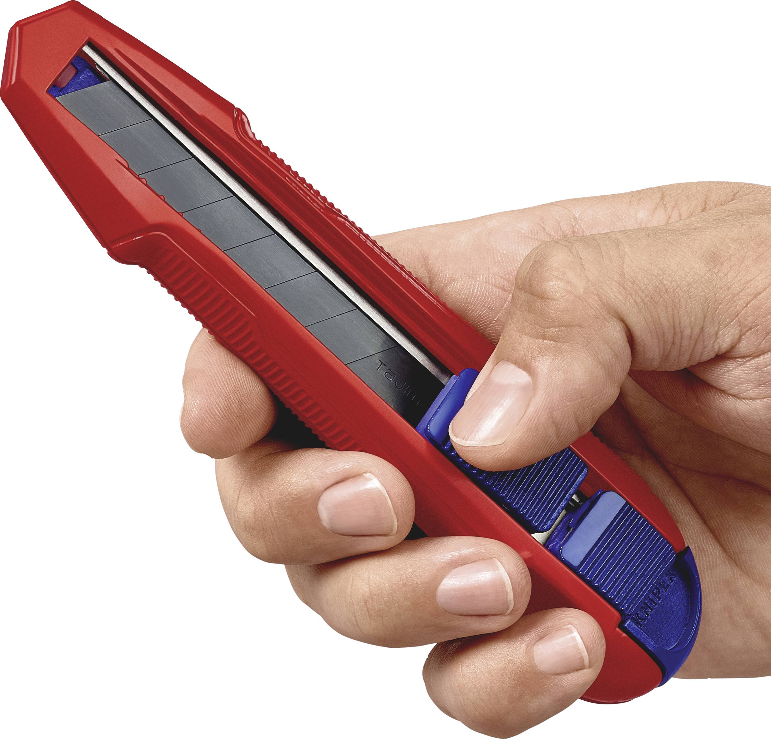 A hand is holding a red Stanley knife with a blue slider.