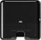 Black Tork paper hand towel dispenser, rectangular, with concealed towels, for wall mounting.