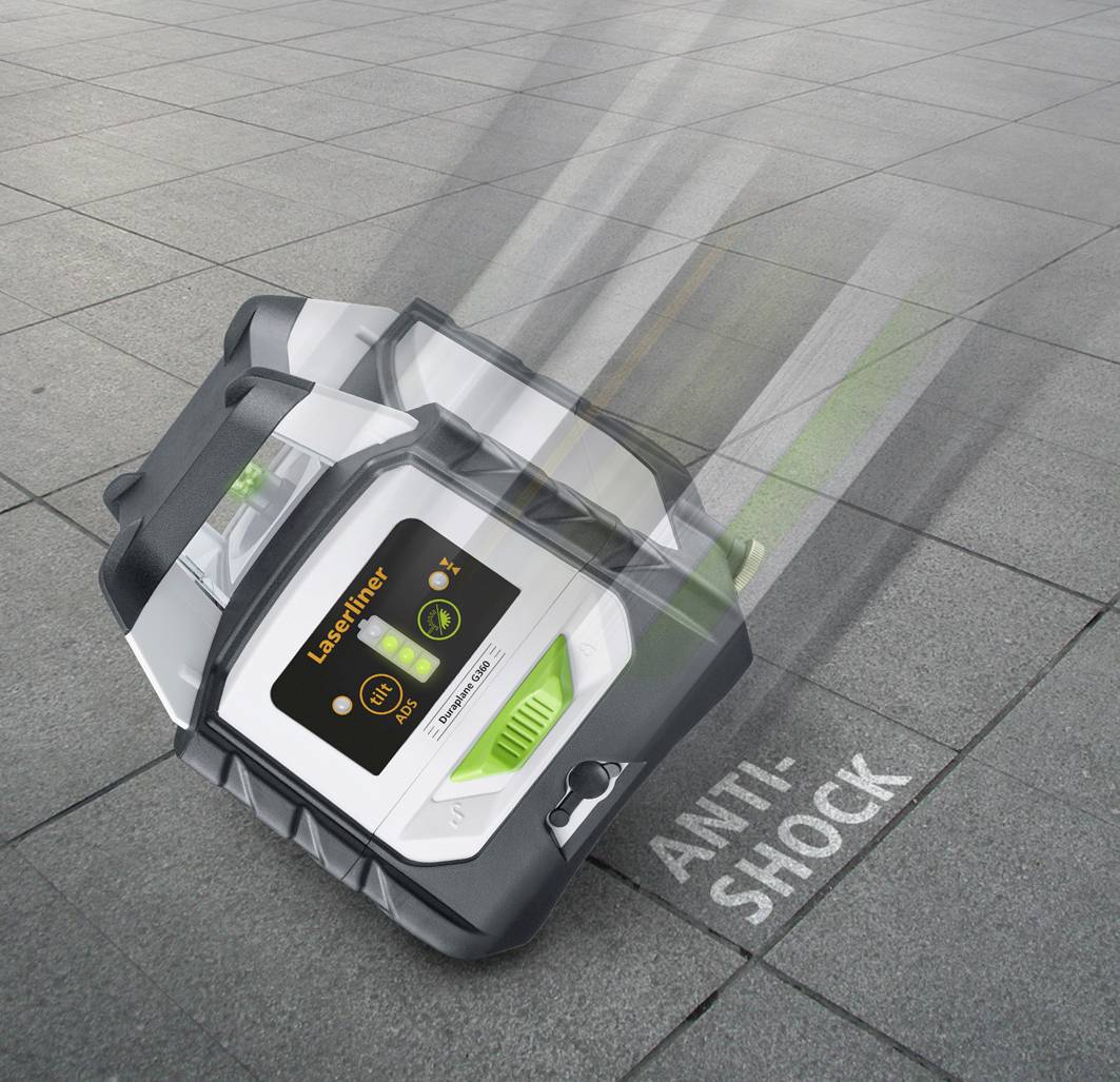 A suitcase lies on the floor with the label 'Anti-Shock'. A motion line suggests that it has just fallen.