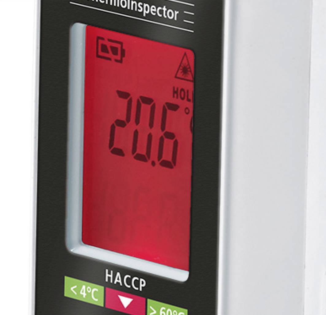 A red display of a temperature measuring device shows '20.6' degrees Celsius. Below are HACCP control indicators and symbols for temperature ranges.
