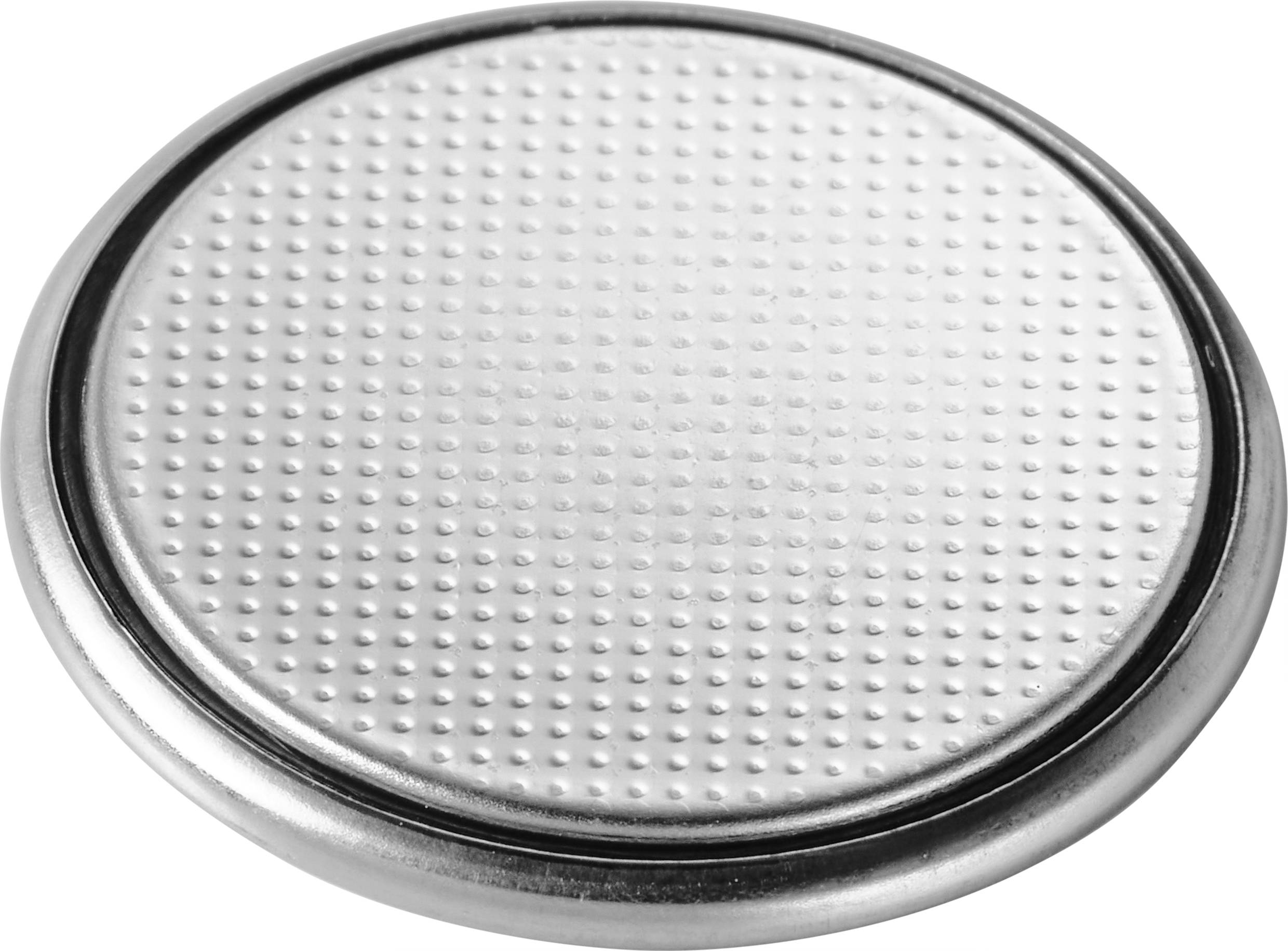A silver button cell battery with a stippled surface.