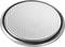 A silver button cell battery with a stippled surface.