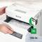 A Leitz paper shredder cuts paper into tiny strips. A stack of 100 A4 sheets is being shredded.