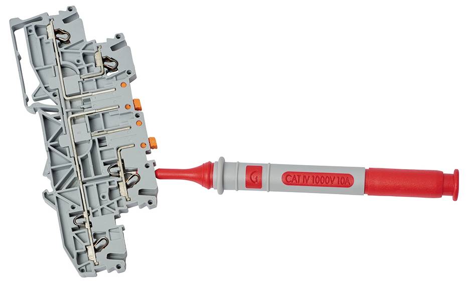 A grey electrical terminal block module with a red voltage tester (CAT IV 1000V) connected to it.