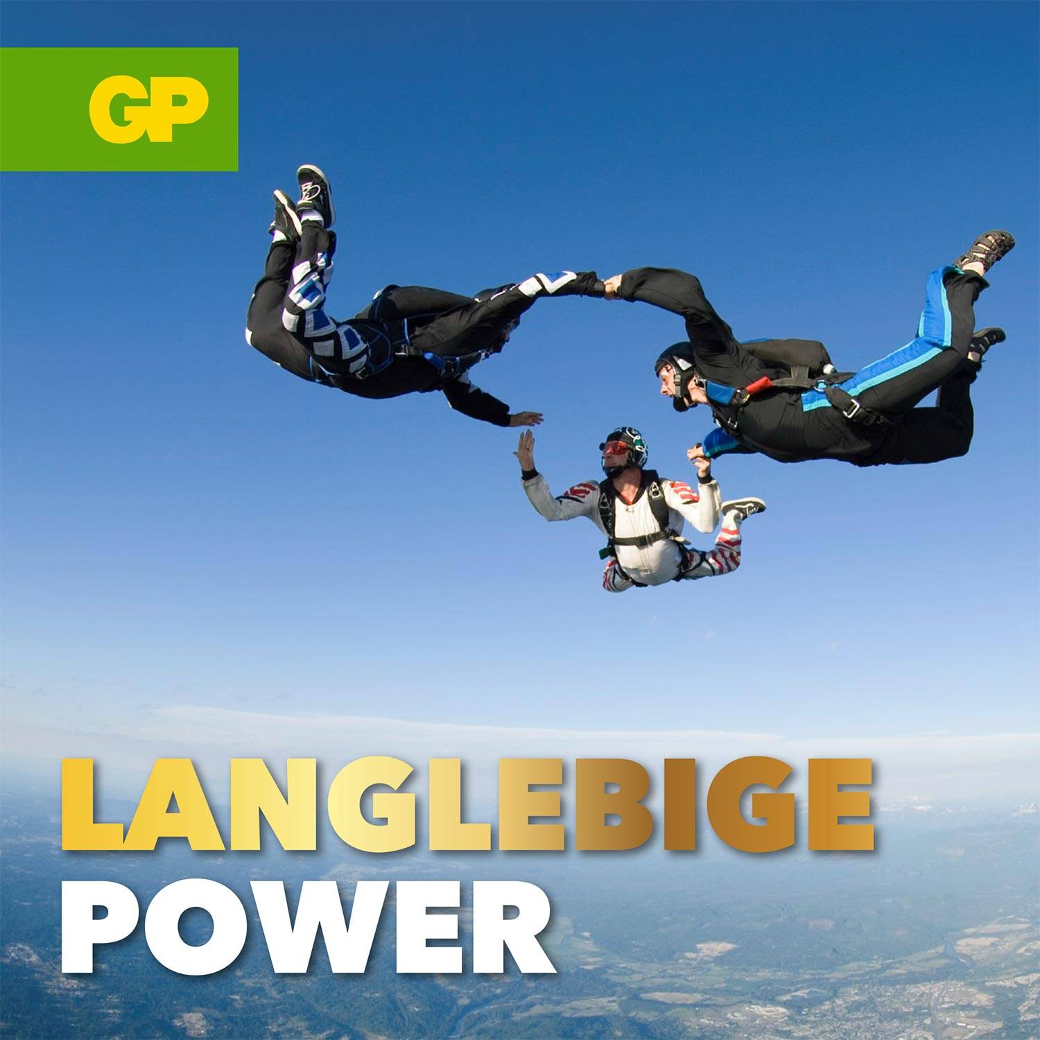 Three parachutists in free fall form a circle against a blue sky. A green 'GP' logo appears in the top left. Text: 'Long-lasting Power'.
