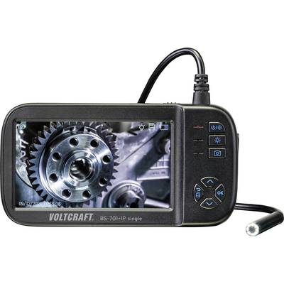 A portable endoscope display shows an enlarged image of a gear wheel. The device has control buttons and an attached probe.