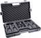 'Open transport case with four radio units and headphones, securely packed in foam inserts.'