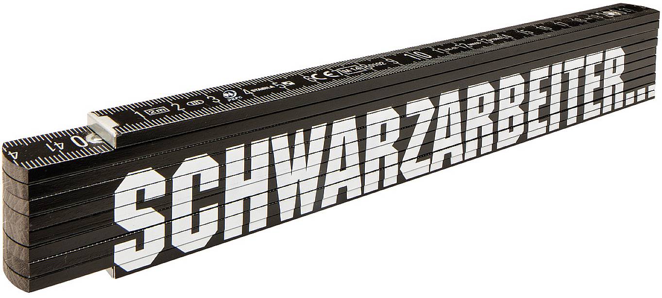 Folding ruler with the word 'SCHWARZARBEITER' in large, white letters on the black surface.