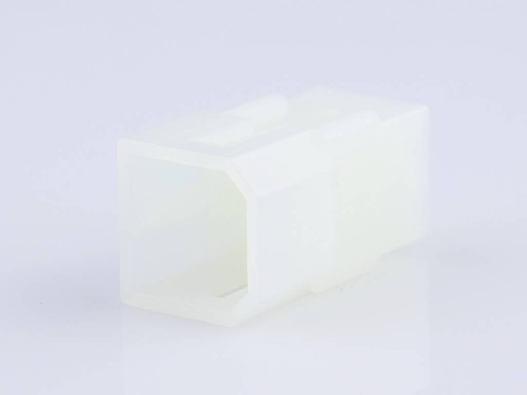 White, hexagonal plastic sleeve on a pale background. Main focus on the sleeve's shape and material.