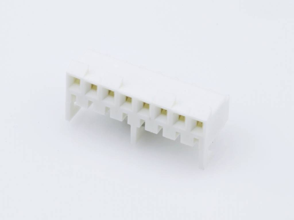 White plastic plug with nine square sockets in two rows, lying on a light surface.