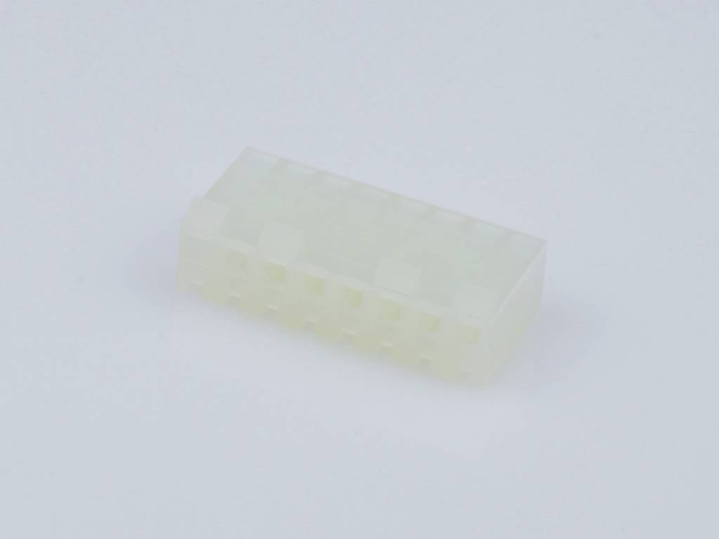 A white plastic plug with multiple openings, compatible with electrical connections, on a light background.