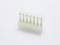 A white plastic plug with six metal pins on a white background.